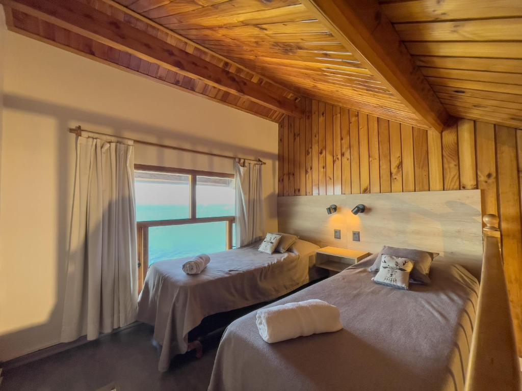 Postel nebo postele na pokoji v ubytování Las Gaviotas