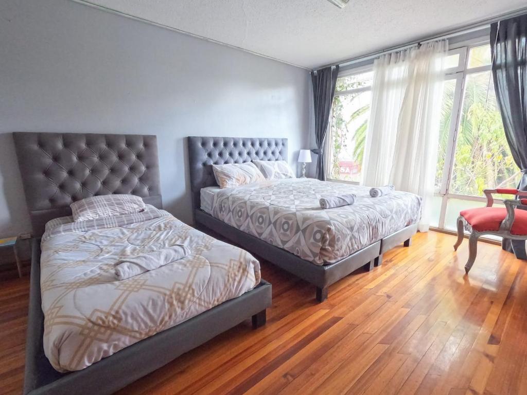 Postel nebo postele na pokoji v ubytování Blue house La Floresta