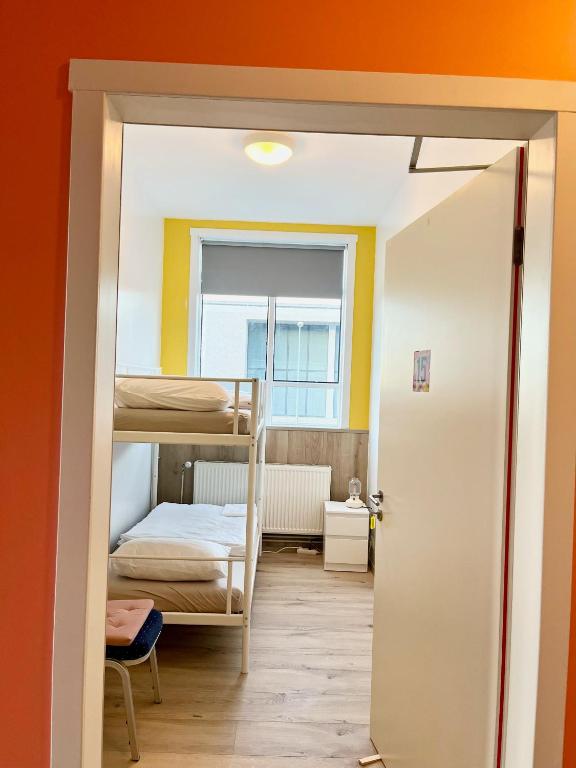 Postel nebo postele na pokoji v ubytování Hostel Fjordur