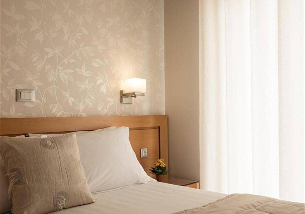 Postel nebo postele na pokoji v ubytování Plaza Hotel
