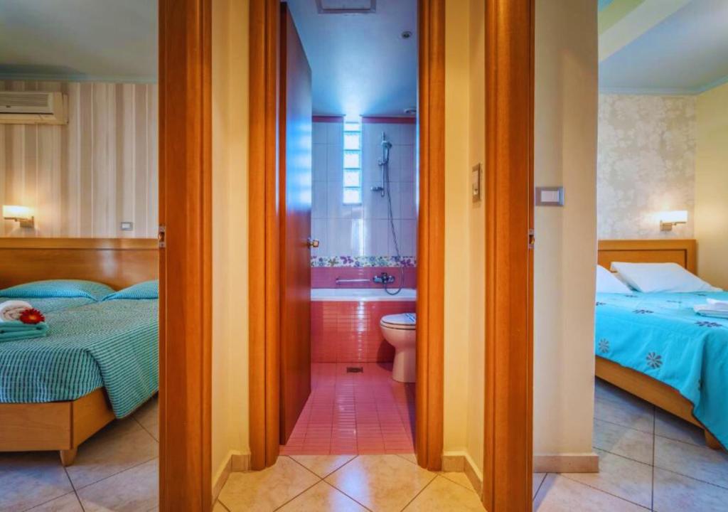 Postel nebo postele na pokoji v ubytování Plaza Hotel