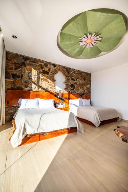 Postel nebo postele na pokoji v ubytování Hotel El Templo