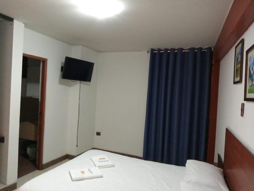 Postel nebo postele na pokoji v ubytování Hostal Bond