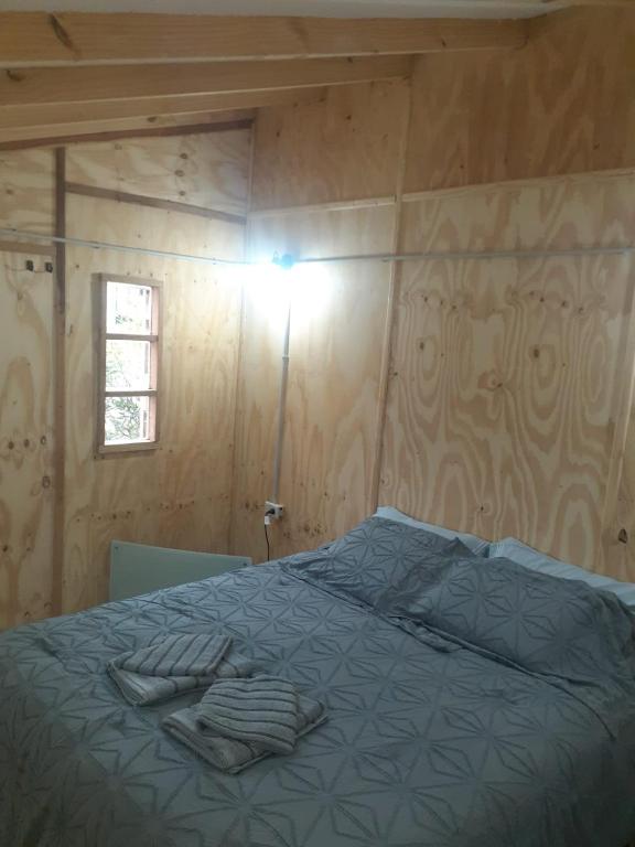 Postel nebo postele na pokoji v ubytování Dos Charitos