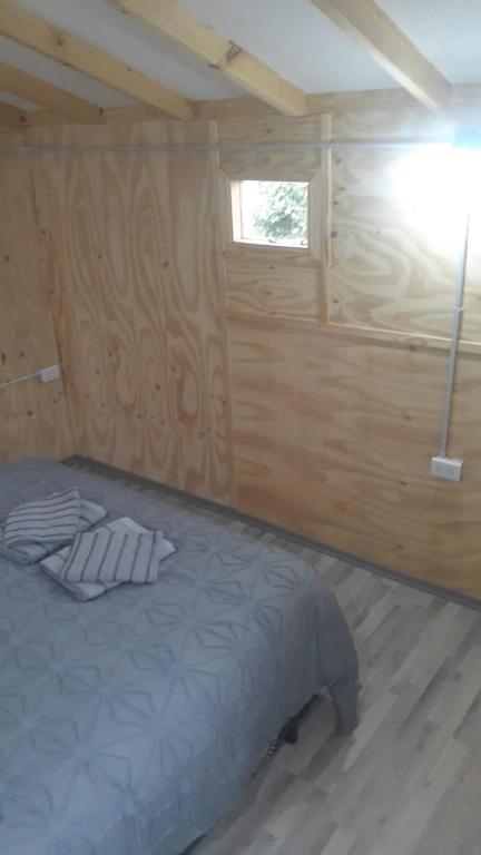 Postel nebo postele na pokoji v ubytování Dos Charitos
