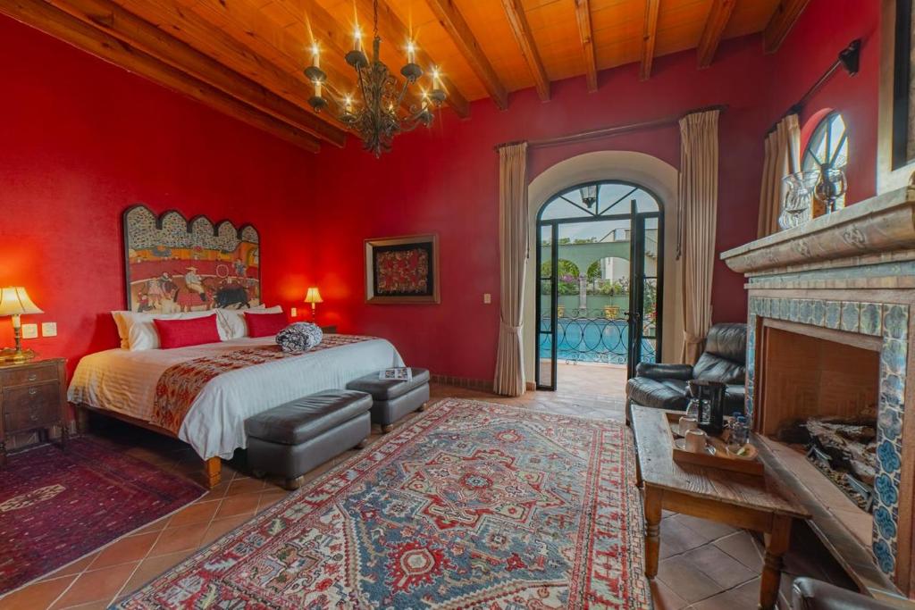 Postel nebo postele na pokoji v ubytování Casa Don Pascual Hotel Boutique Sweet Home