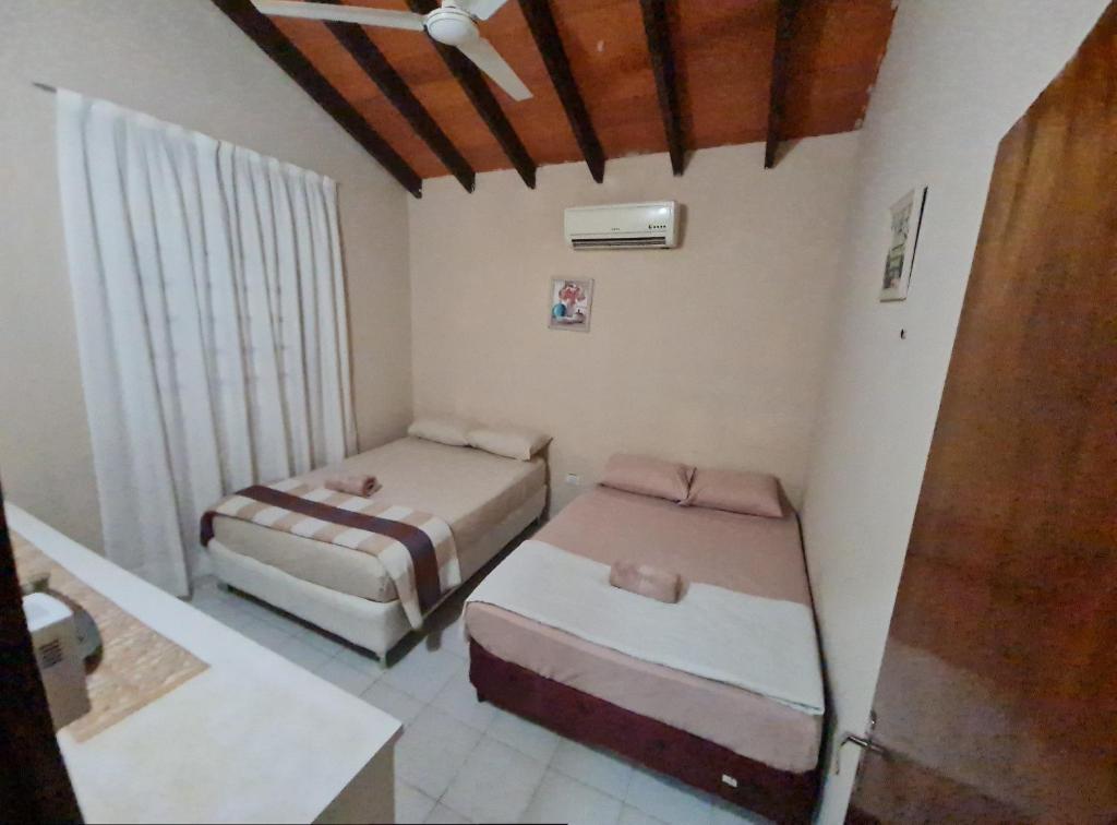 Postel nebo postele na pokoji v ubytování La casa de Aldo y Paty