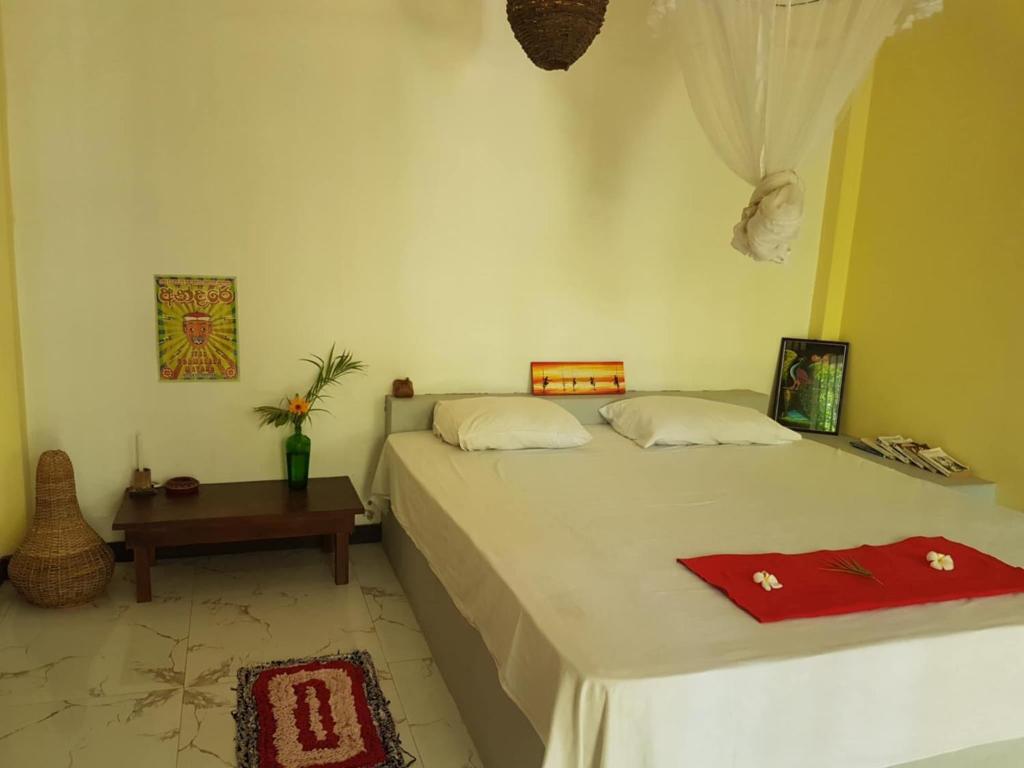 Ένα ή περισσότερα κρεβάτια σε δωμάτιο στο Danushka Family Guesthouse