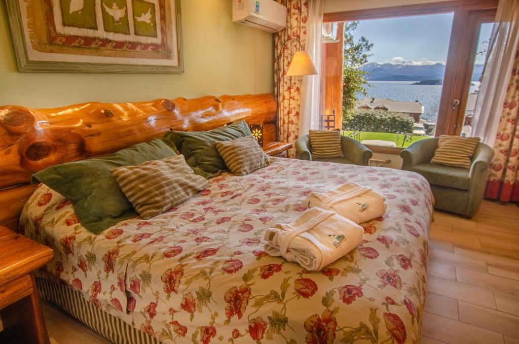 Cama ou camas em um quarto em Nido del Cóndor Hotel & Spa