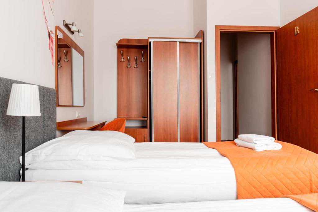 Postel nebo postele na pokoji v ubytování Dom Wczasowy Zew Morza - Basen, Spa, Wyżywienie w Cenie