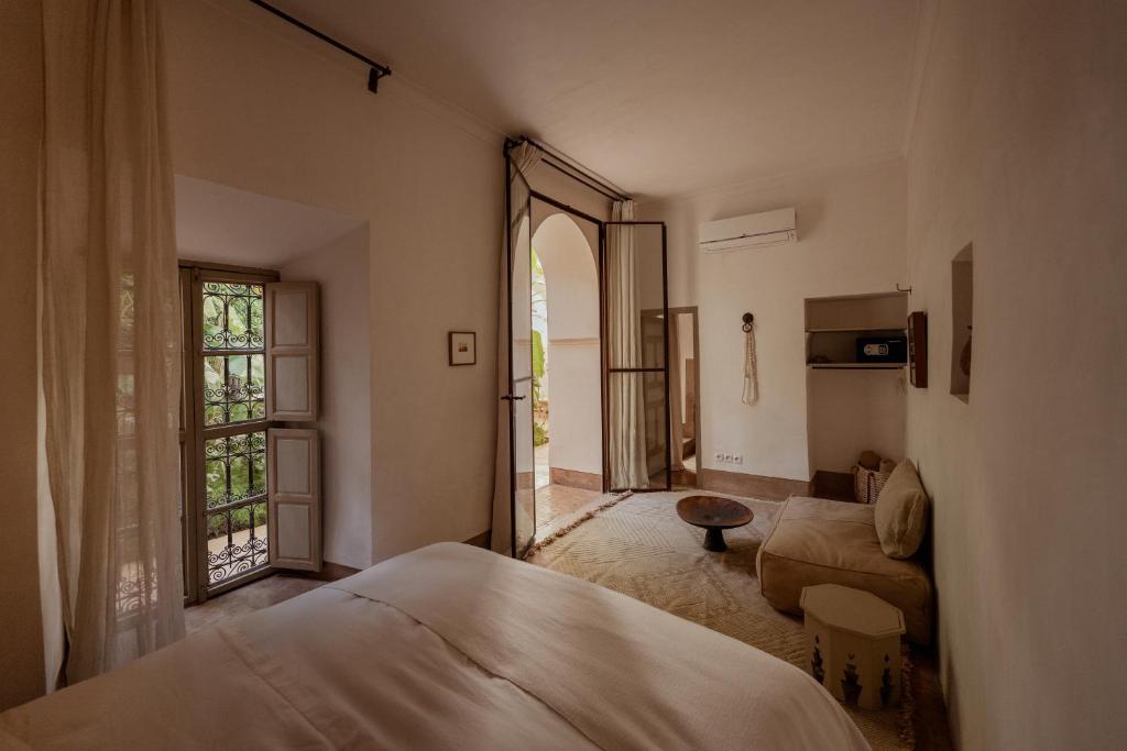 Postel nebo postele na pokoji v ubytování Riad Berbère Marrakech
