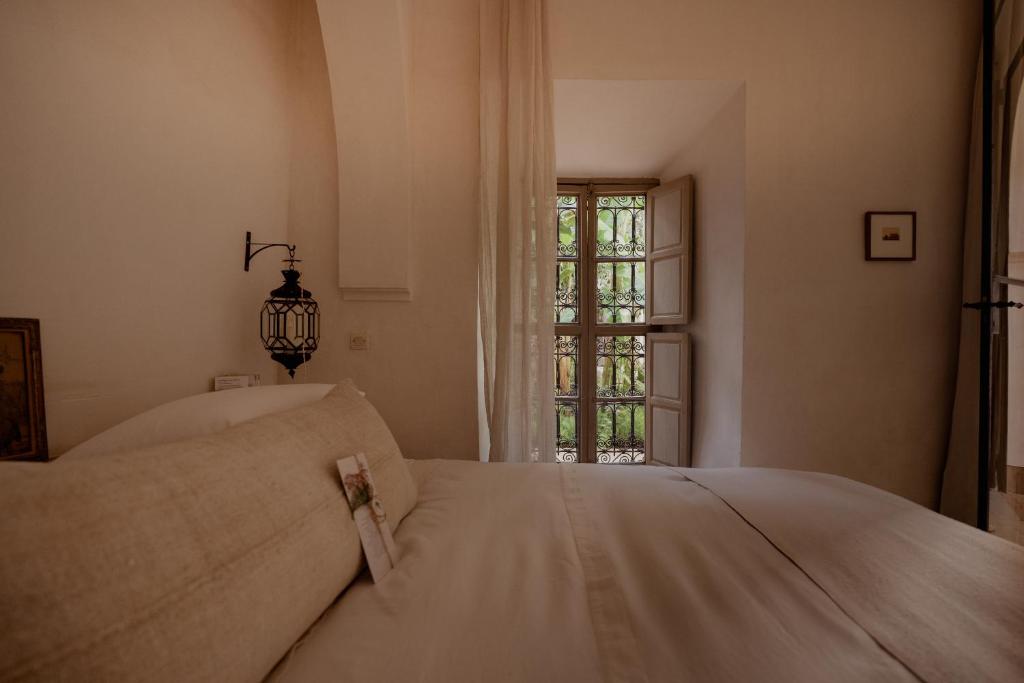 Postel nebo postele na pokoji v ubytování Riad Berbère Marrakech