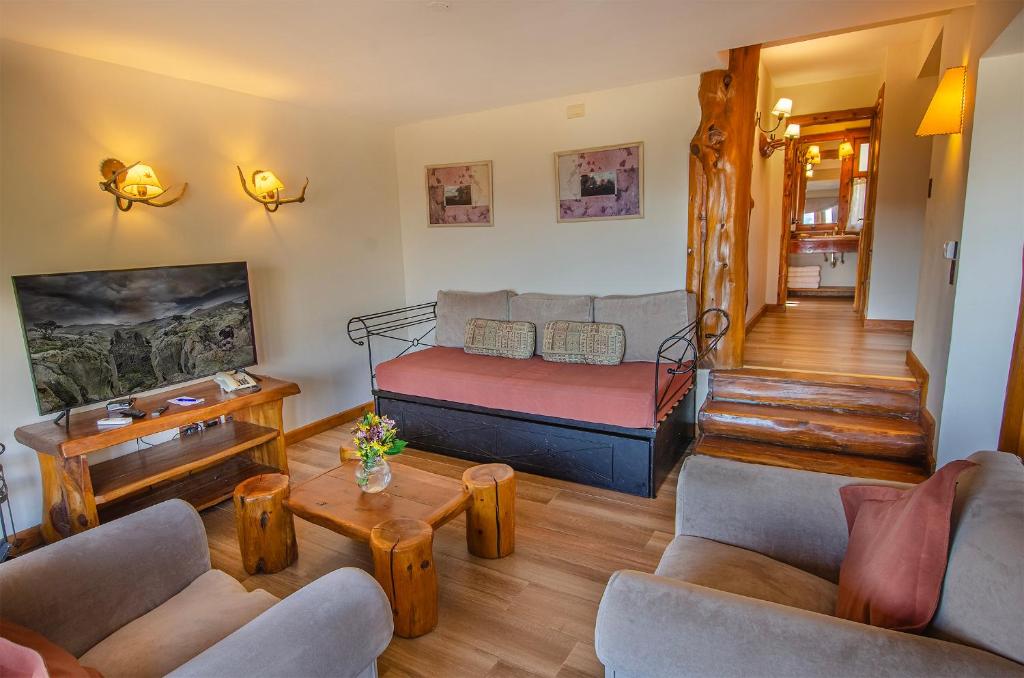 Uma área de estar em Nido del Cóndor Hotel & Spa