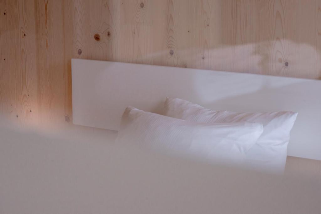 Postel nebo postele na pokoji v ubytování Bader Hotel