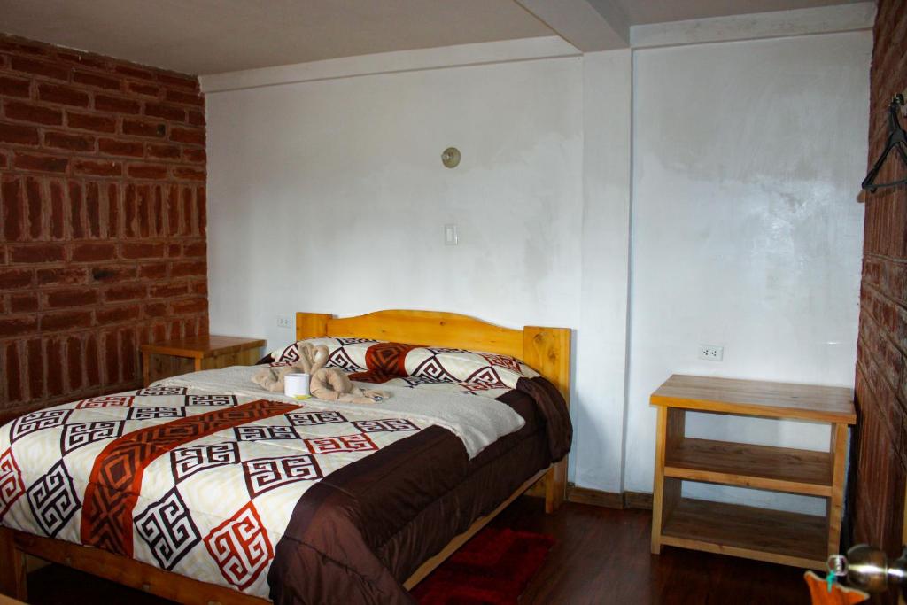 Postel nebo postele na pokoji v ubytování Hostal Cloud Forest