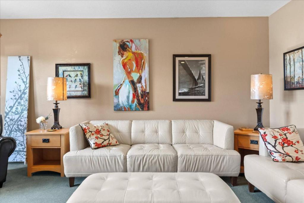 a living room with a couch and a table at Cozy 2.4 in Hayden