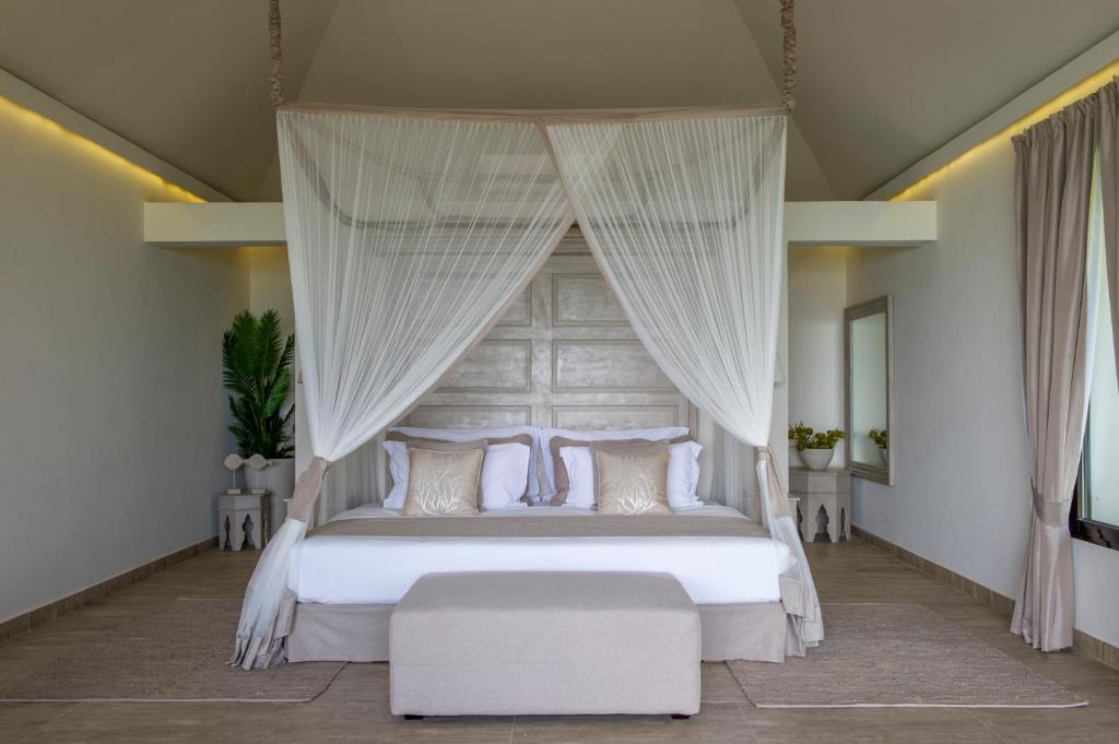 Postel nebo postele na pokoji v ubytování Zawadi Hotel, Zanzibar