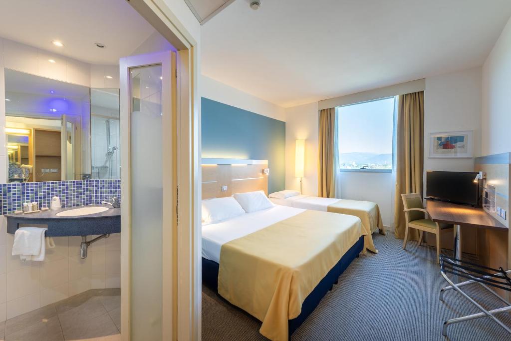 Postel nebo postele na pokoji v ubytování Meditur Hotel Udine Nord