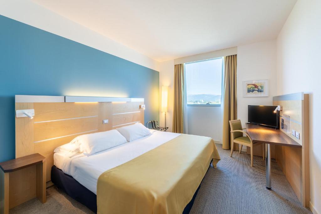 Postel nebo postele na pokoji v ubytování Meditur Hotel Udine Nord