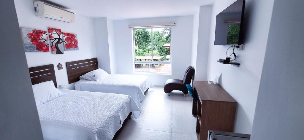 Postel nebo postele na pokoji v ubytování Hotel Suma Wasi