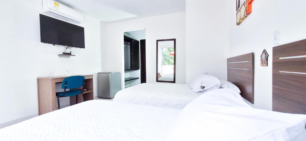 Postel nebo postele na pokoji v ubytování Hotel Suma Wasi