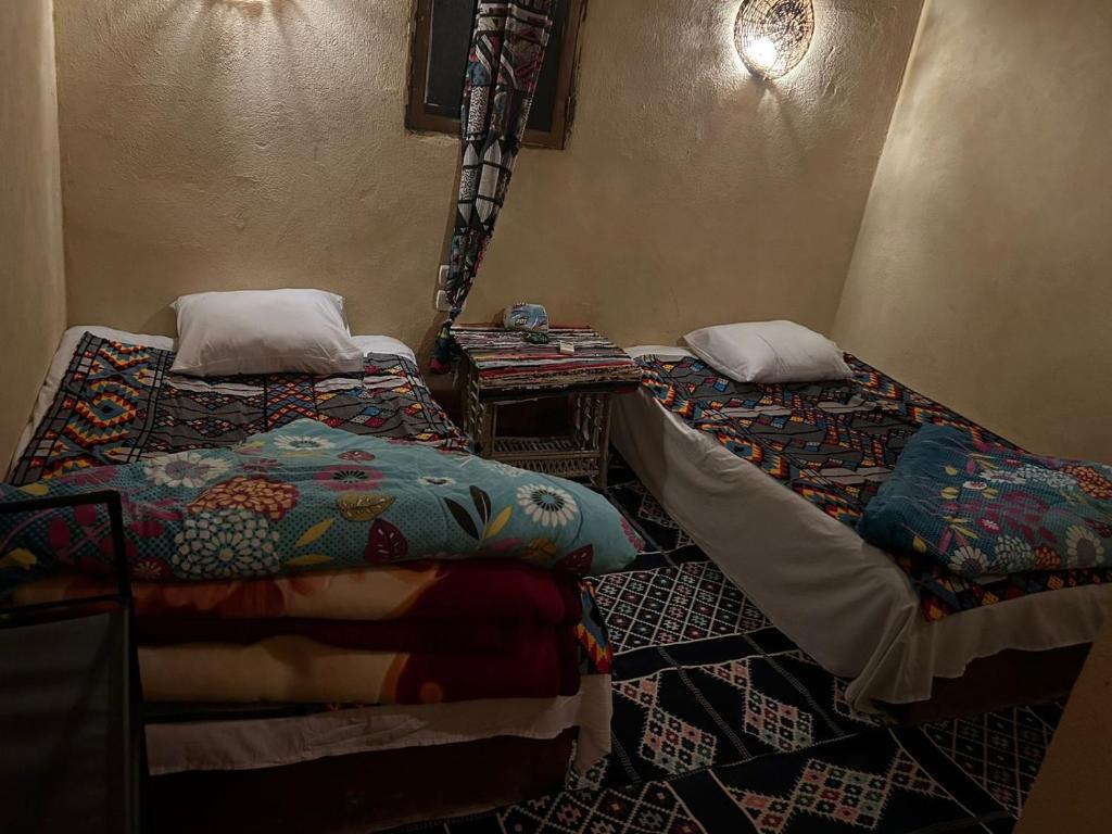 Postel nebo postele na pokoji v ubytování Pr Sen Lodge
