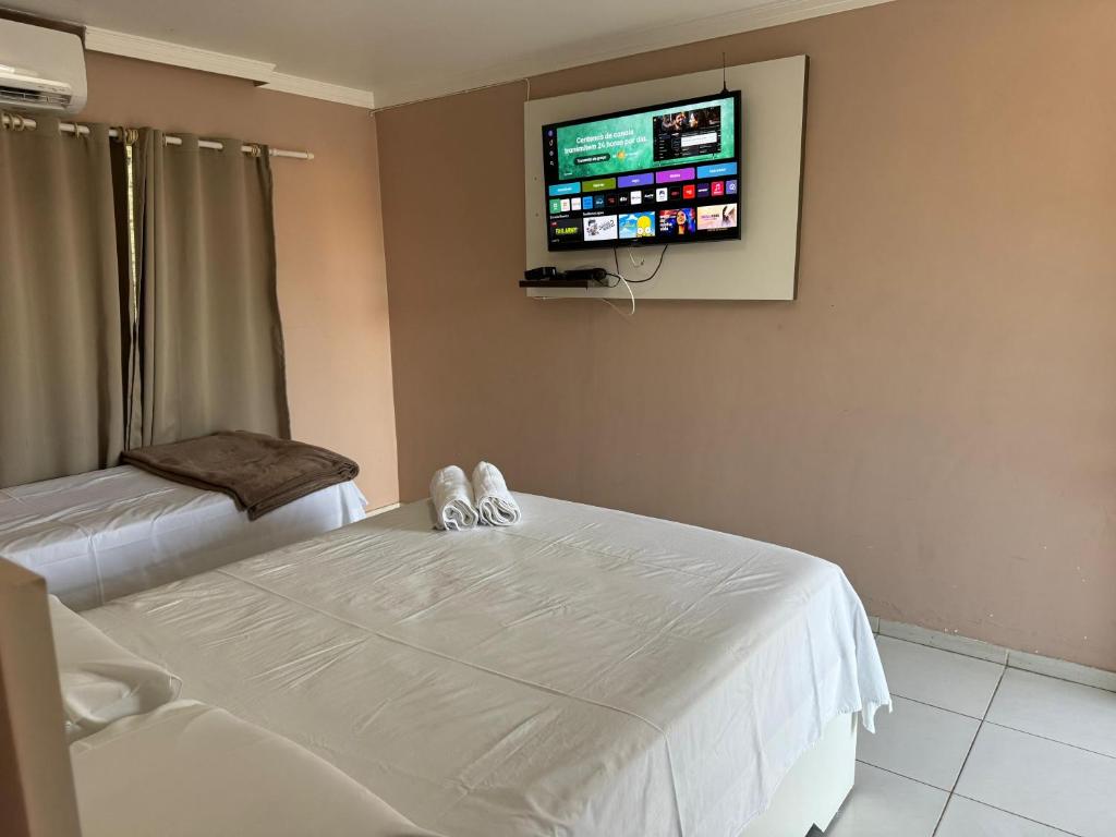 Postel nebo postele na pokoji v ubytování Hotel Serra do Rio
