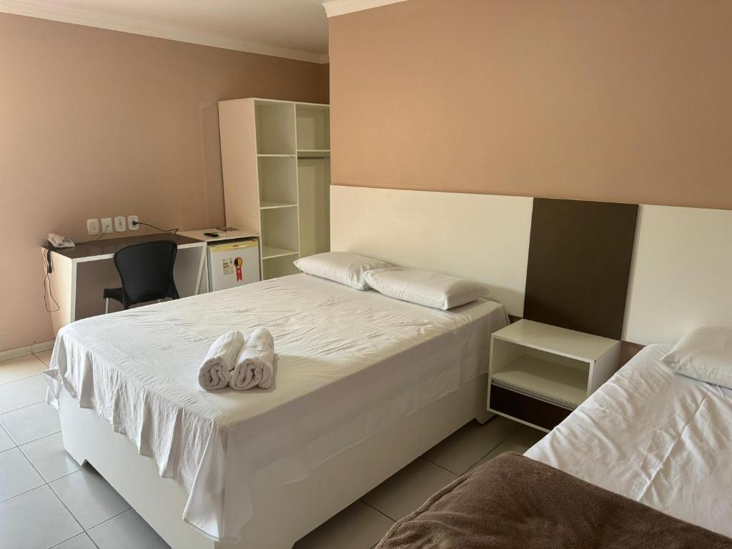 Postel nebo postele na pokoji v ubytování Hotel Serra do Rio