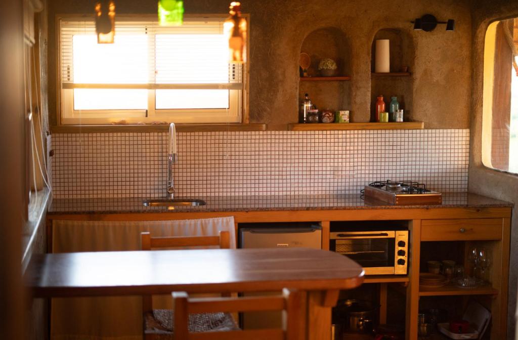 Kuchyň nebo kuchyňský kout v ubytování Los Chajá Ecolodge