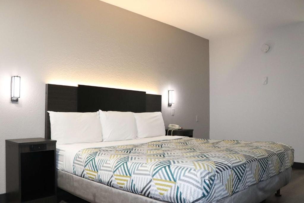 Un ou plusieurs lits dans un hébergement de l'établissement Motel 6-Birmingham, AL