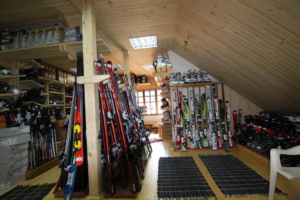 a room with a bunch of skis in a attic at Blizzard in Slavske
