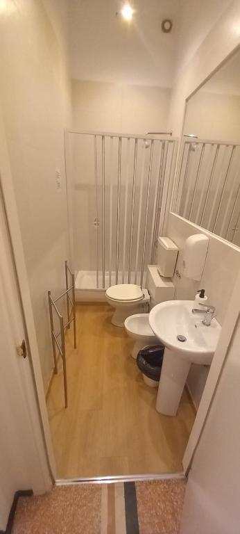 a bathroom with two toilets and a sink at Room and Suite - BARI CENTRALE - in Bari