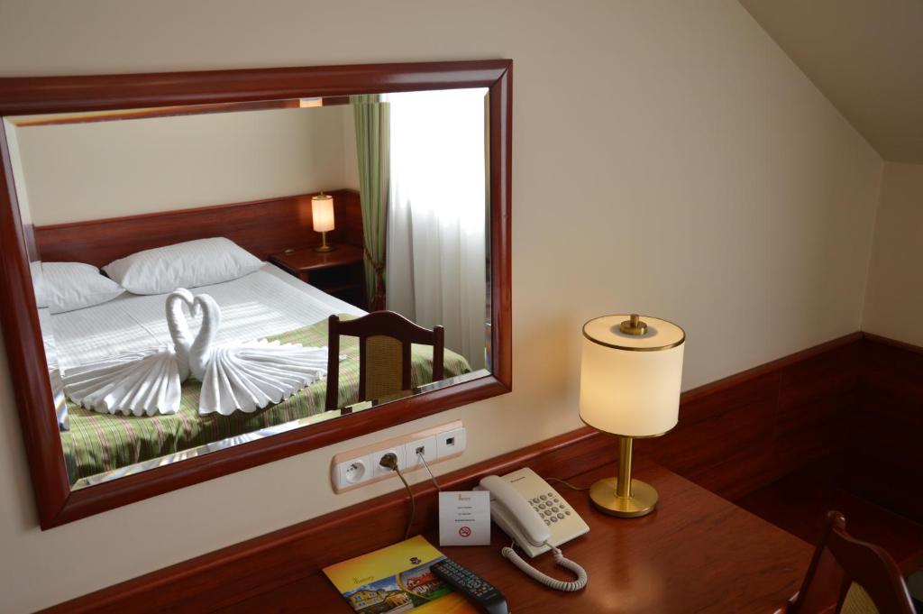 Posteľ alebo postele v izbe v ubytovaní Hotel Batory