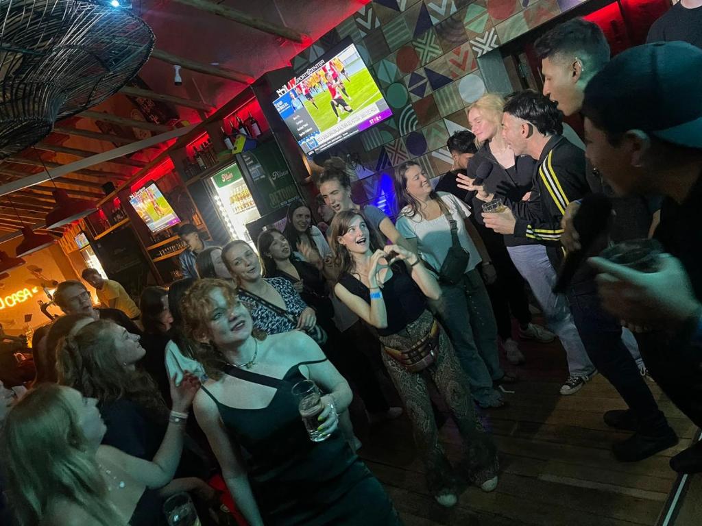 a crowd of people dancing in a bar at Viajero Cusco Hostel in Cusco