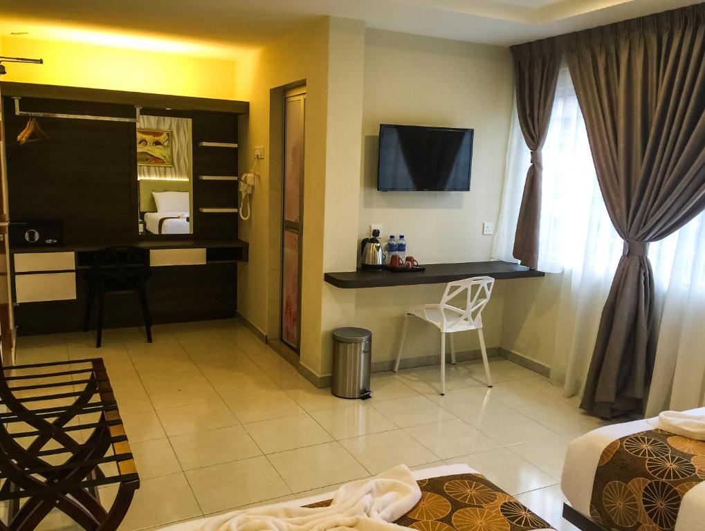 TV a/nebo společenská místnost v ubytování Louis Hotel