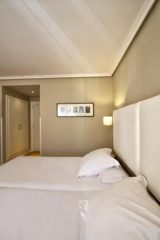 Postel nebo postele na pokoji v ubytování Hotel Los Lagos Nature