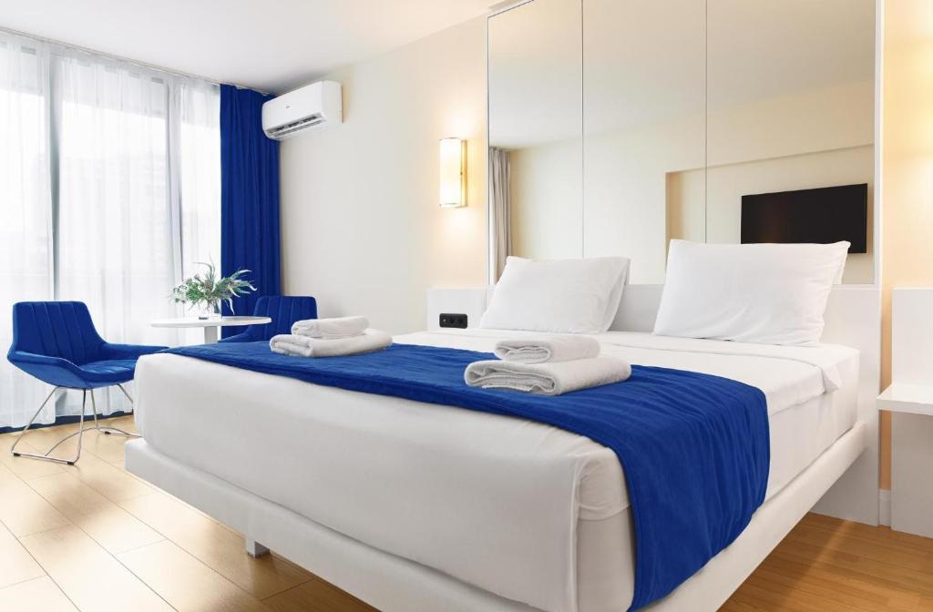 Postel nebo postele na pokoji v ubytování VIP ORBI CITY batumi