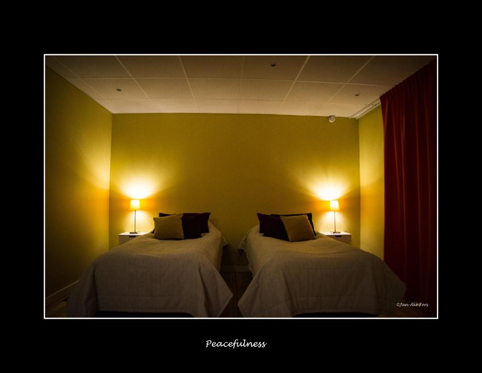 Postel nebo postele na pokoji v ubytování Lannavaara Lodge