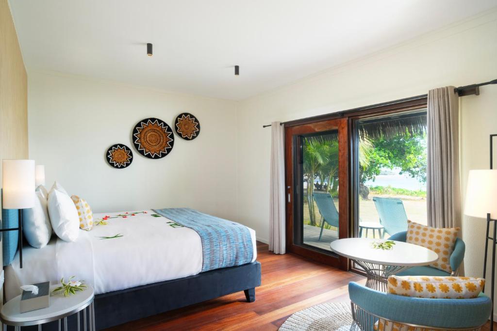 Postel nebo postele na pokoji v ubytování Yatule Resort & Spa