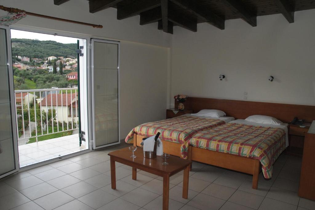 Postel nebo postele na pokoji v ubytování SeaBird Hotel