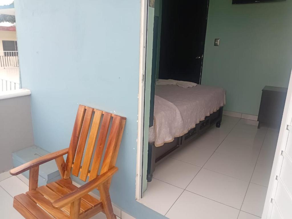 Postel nebo postele na pokoji v ubytování HOTEL ACUARIO CATEMACO