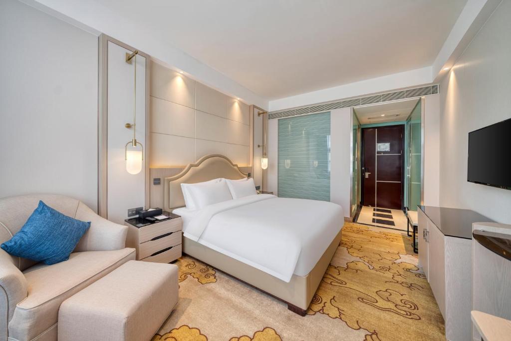 Postel nebo postele na pokoji v ubytování Dayhello Hotel Shenzhen Shekou