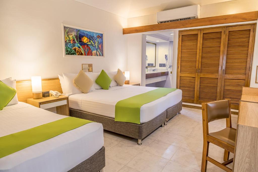 Postel nebo postele na pokoji v ubytování Hotel Irotama Bungalows & Bohios