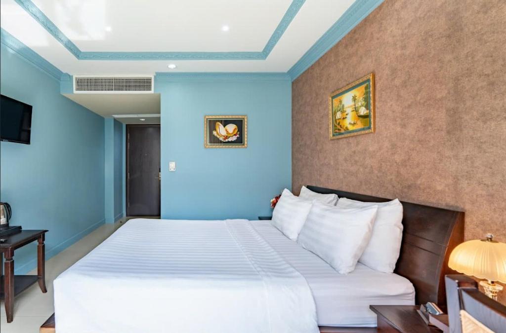 Giường trong phòng chung tại La Bonita Boutique Hotel