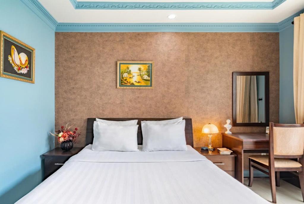 Giường trong phòng chung tại La Bonita Boutique Hotel