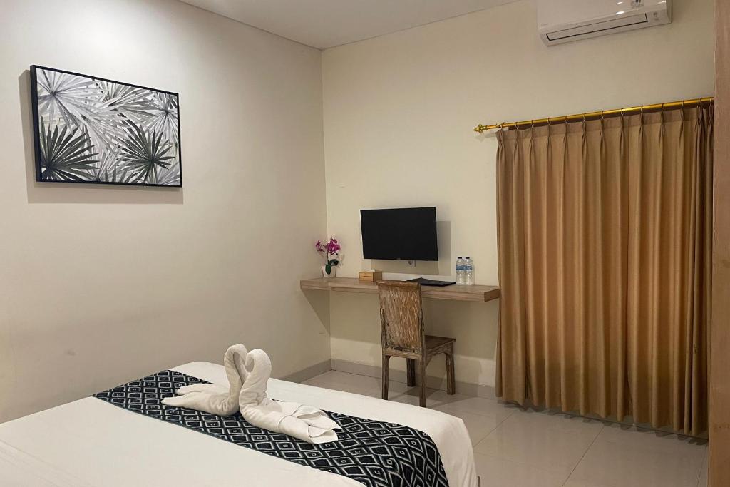 TV a/nebo společenská místnost v ubytování Singgah Hotel Seminyak