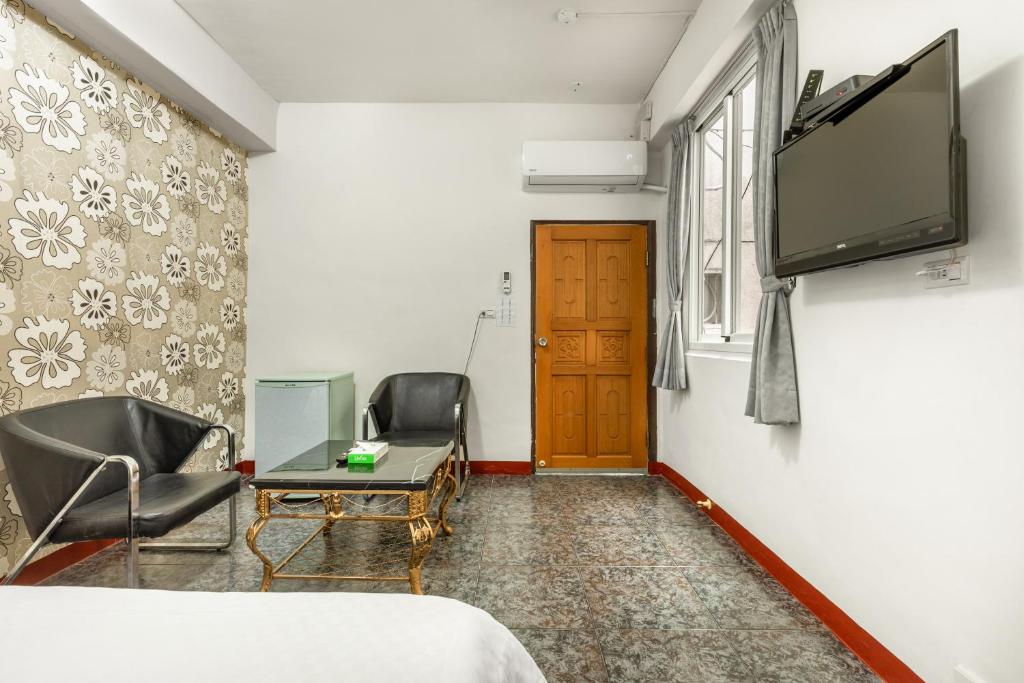 TV a/nebo společenská místnost v ubytování Rich House B&B