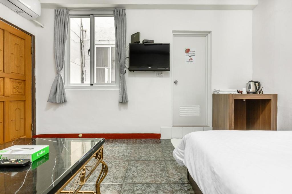 TV a/nebo společenská místnost v ubytování Rich House B&B