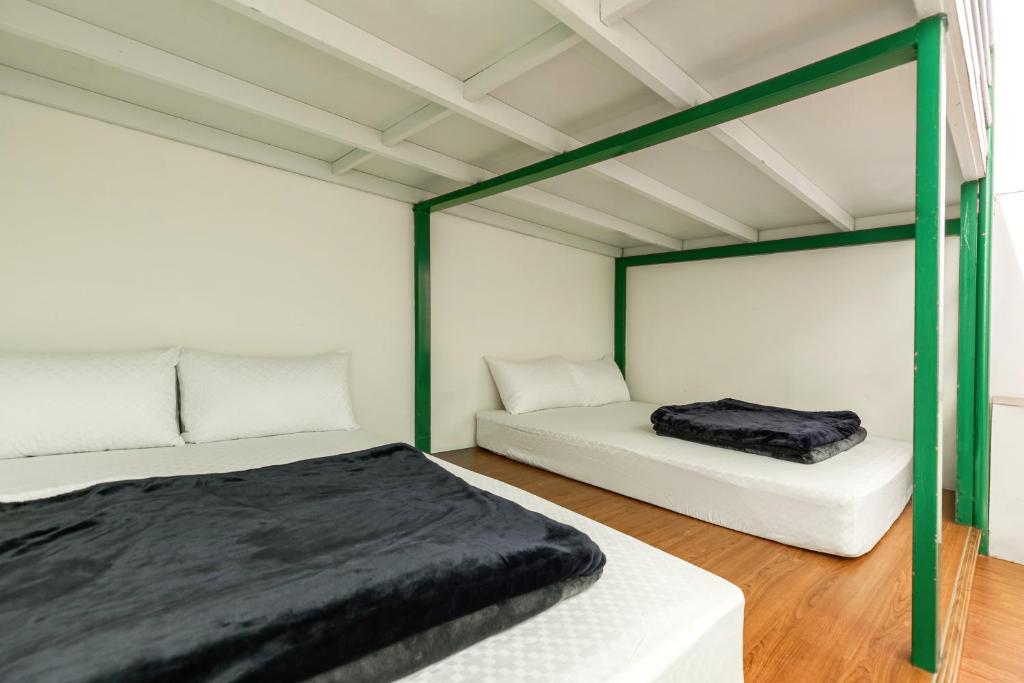 Postel nebo postele na pokoji v ubytování Rich House B&B