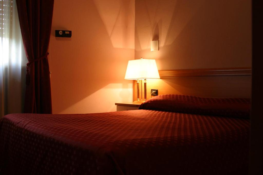 Postel nebo postele na pokoji v ubytování Air Hotel